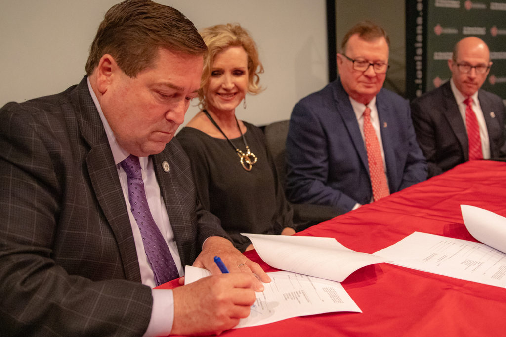 Photo caption: From left are Lt. Gov. Billy Nungesser, Dr. Connie Castille, state director, U.S. Department of Agriculture; Dr. Joseph Savoie, UL Lafayette president; and Dr. Jaimie Hebert, University provost and vice president for Academic Affairs. The four participated in a signing ceremony and announcement Thursday of a $250,000 state grant the University received to examine the seafood supply chain in seven coastal Louisiana parishes. (Photo credit: Rachel Keyes / University of Louisiana at Lafayette)