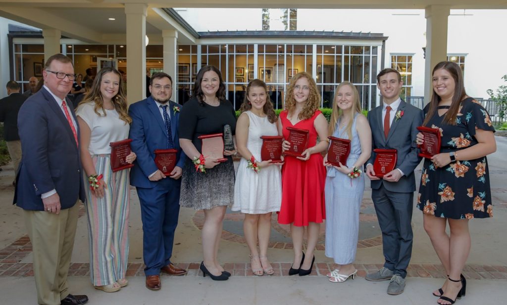 Photo caption: Dr. Joseph Savoie, UL Lafayette president (far left), with Spring 2019 Outstanding Graduates. The honorees are, from left: Hallie Dodge, College of Education; Zach Wells, B.I. Moody III College of Business Administration; Ada F. Tusa, Ray P. Authement College of Sciences; Sarah DiLeo, College of the Arts; Abigail Gatzy Morton, College of Liberal Arts; Theresa Sapera, College of Nursing and Allied Health Professions; Kyle Farmer, College of Engineering; and Haley Brooke Campbell, University College. (Photo credit: Rachel Keyes / University of Louisiana at Lafayette)